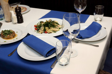 serving banquet table in a restaurant in blue and white style