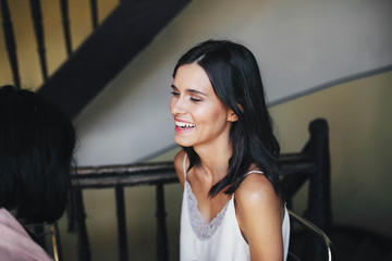 beautiful,young and smiling girl sitting on chair