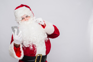 Santa Claus makes a selfie on white background