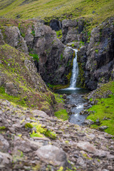 Obraz premium Waterfall at the Akrafjall mountain in Iceland