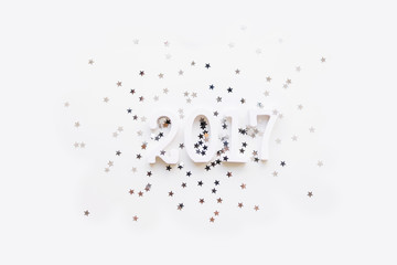 New Year 2017 background with stars confetti. Place for text. Flat lay, top view.