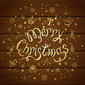 Merry Christmas with decorations on brown wooden background