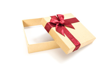Paper gift box with deep red ribbon with a bow, on white background.