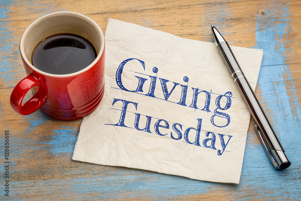 Wall mural Giving Tuesday concept on napkin