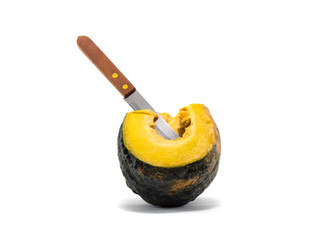 a knife stab equal part pumpkin on white background