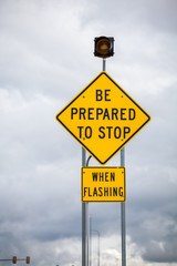 Be prepared to stop when flashing - road sign