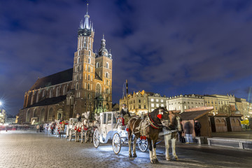 Obraz premium Mary's Church and white carriage, Krakow, Poland