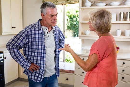 Senior woman fighting in kitchen
