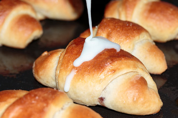 Fresh croissants topped with icing