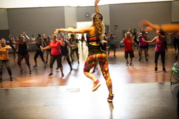 group of young people working out in a fitness gym