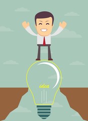 Businessman on a bulb cross an abyss