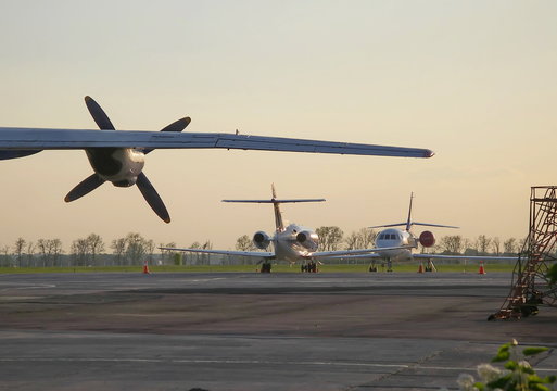 Airplane Wing With Propeller And Two Private Jet Aircraft