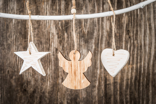 Handmade Christmas decorations over rustic wooden background