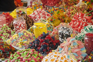 assortment colorful gummy candies at market (selective focus)