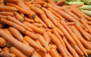 Organic carrots. Fresh organic carrots. Background texture of carrots. Healthy eating. Fall harvest, agricultural farming concept (selective focus)