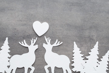Christmas background. White tree decorations on a gray backgroun