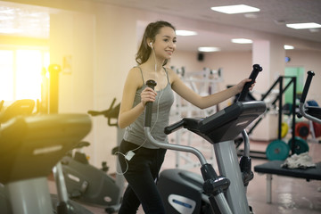 Woman working out on a fitness equipment