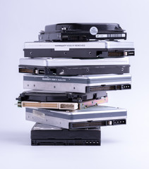 Pile of old hard drive on white background.