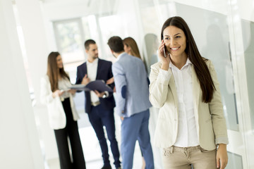 Obraz premium Businesswoman with mobile phone