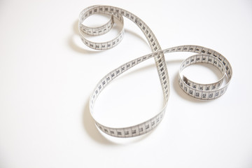 Measure tape and white background