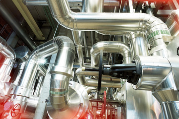 Equipment, cables and piping as found inside of a industrial power plant