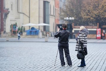 Prague, Czechia - November, 21, 2016: tourast shoots on Old Town Square in the center of Prague, Czechia