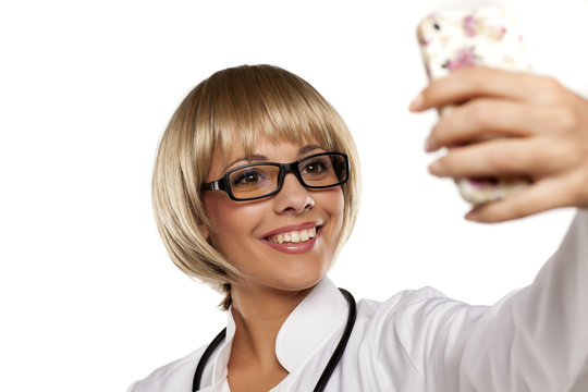 Attractive Young Doctor With Blond Short Hair Takes Selfies