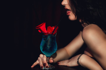 sexy woman drinking a cocktail