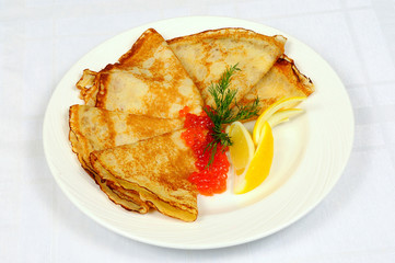 Russian pancakes with red caviar