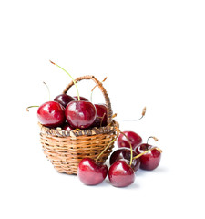 Cherries  in wicker basket isolated on white background