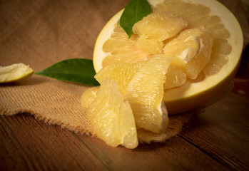 Fresh pomelo on wooden background