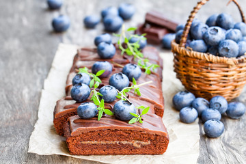 Chocolate  cake with chocolate cream and fresh blueberries