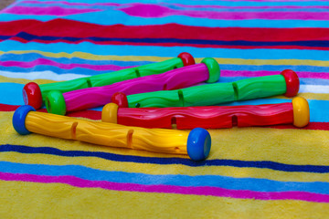 Colourful swimming pool sinking toys to dive out of water on a s