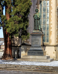 Fototapeta na wymiar Statue of Ulrich Zwingli at the Water Church in Zurich, Switzerland