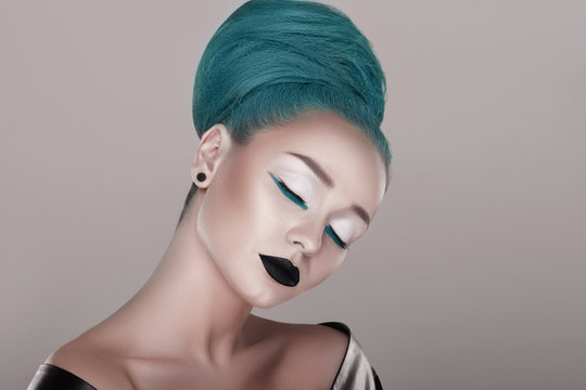 creative and futuristic look of fashion woman with green hair