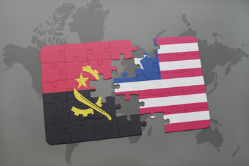 puzzle with the national flag of angola and liberia on a world map.