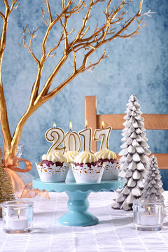 New Year 2017 cupcakes on a winter theme table setting