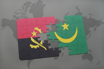 puzzle with the national flag of angola and mauritania on a world map.
