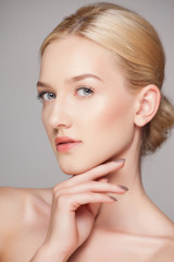 Fashion blonde woman with beautiful face - isolated on white. Skin care concept.