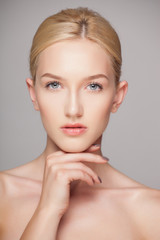 Fashion blonde woman with beautiful face - isolated on white. Skin care concept.