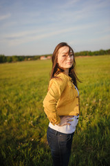 Happy young girl enjoying the beauty of sunny spring day