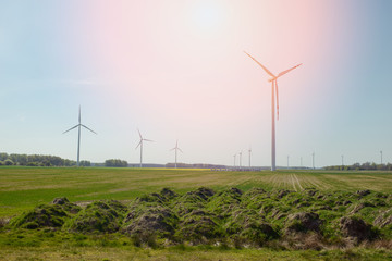 Bright blue sky moving and wind turbine