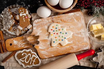 cooking christmas gingerbread on wooden background top view