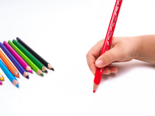 Naklejka premium Girl draws with colored pencils