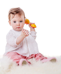 Girl playing rattle