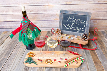 Naklejka na ściany i meble Holiday wine flight with chalkboard sign and decorations