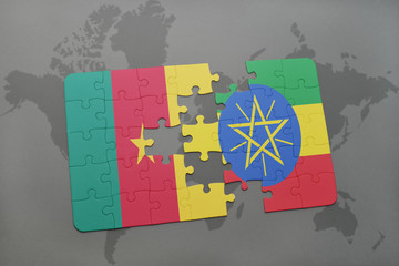 puzzle with the national flag of cameroon and ethiopia on a world map.
