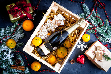 New Year's champagne and tangerines in box top view