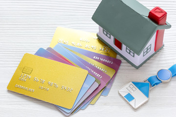 credit cards concept mortgag for new home on wooden background