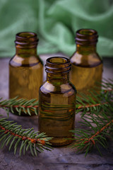 Fir tree essential oil in small bottles